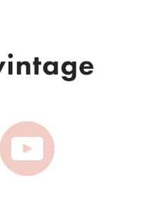 A close-up shot shows the word 'vintage' in black text on a white background, with a pink circle containing a white play button icon to the left.